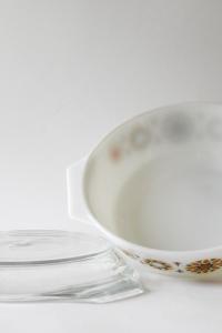 JAJ Pyrex. TOLEDO Bowl with orange and black flowers. Lid and dish. Pyrex Glass Stovetop. 1969s Collectible